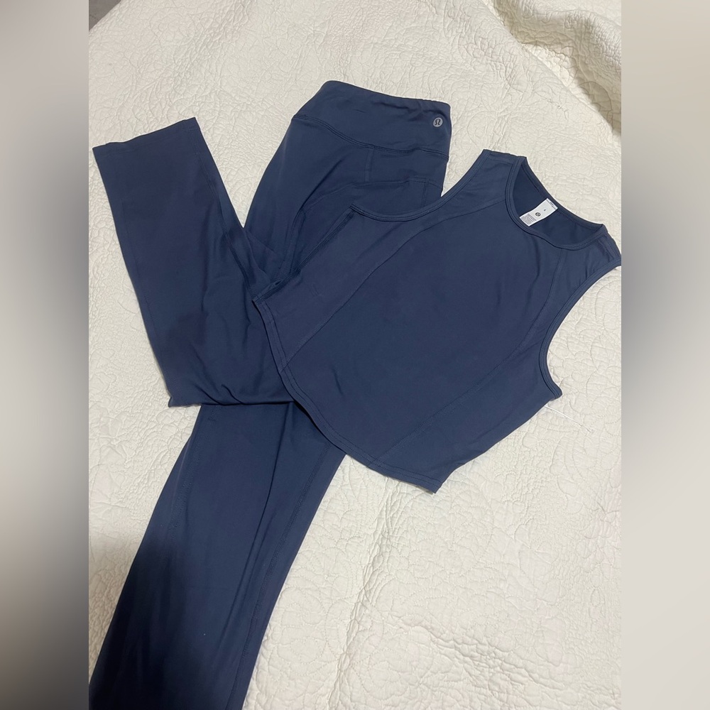 Lululemon Light blue-lavender sleeveless top and matching leggings set.